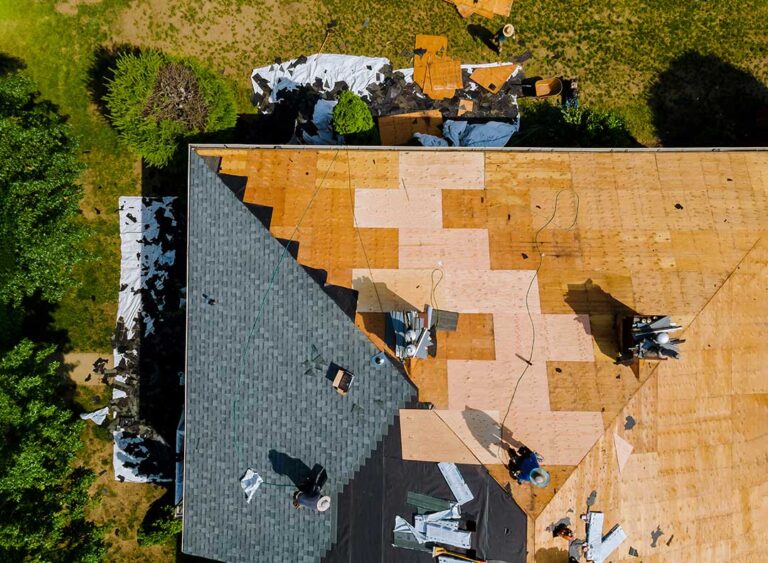 Roofing documents and material samples displayed beside a roof assembly diagram showing Class A, B, and C ratings.